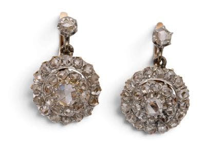 A pair of diamond cluster earrings. Set with rose-