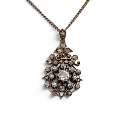 A diamond pendant, ca. 1900. Rosette-shaped, set w