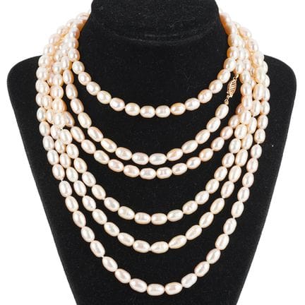 PEARLS, 14K GOLD
Long necklace made of semi-round 