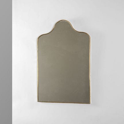 UN MIROIR MURAL  des années 50. 
Laiton  et crista