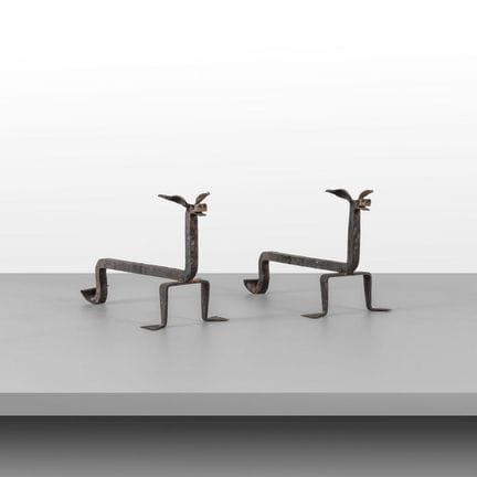 A PAIR OF FIREPLACE TENDERS from the 1950s. 
Wroug