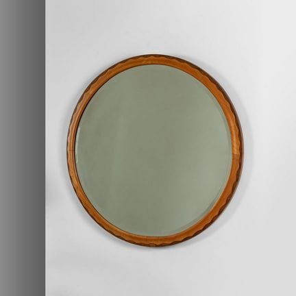 UN MIROIR MURAL  des années 50. 
Bois d'érable tei