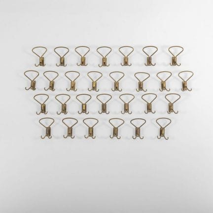 TWENTY-EIGHT WALL-MOUNTED COAT HOOKS  from the 195