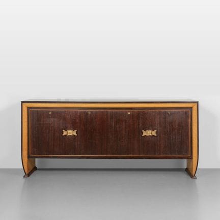 UNA CREDENZA  anni '40.
Varie essenze di legno  pi