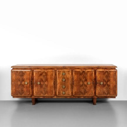 UNA CREDENZA  anni '30.
Radica di noce  ottone.
Cm