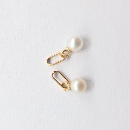 Two 18K yellow gold (750) pendants adorned with cu
