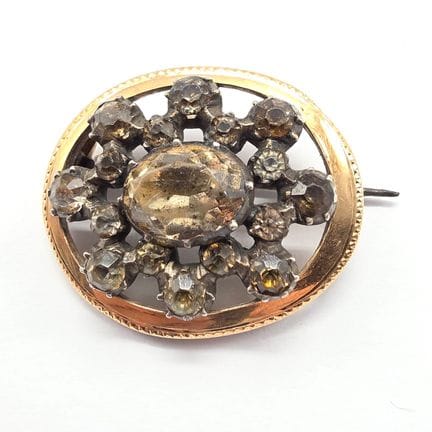 Brosche aus 18-karätigem Gelbgold (750°°) und Stah