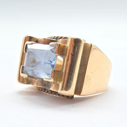 18K yellow gold (750°°) bridge ring set with a ste