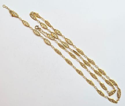 Sautoir en or jaune 18 K (750°°) Poinçon Tête d'ai