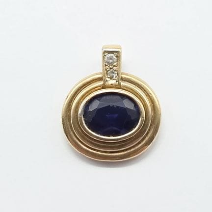 9K yellow gold (750°°) pendant with a bail set wit