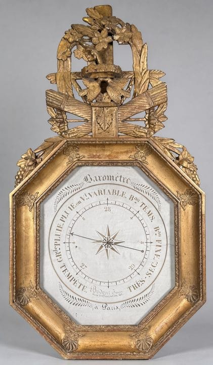 BAROMETRE en bois doré et sculpté de forme octogon