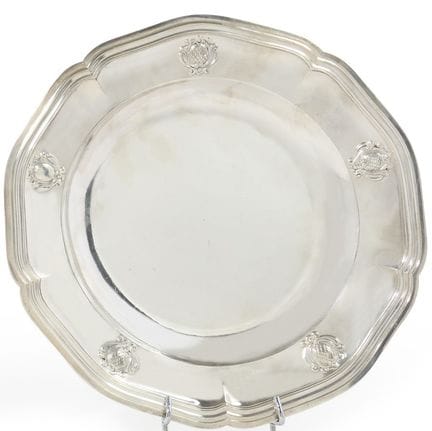 Circular silver platter with five decorative borde