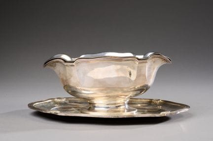 Gravy boat with a fixed silver (950) rim, featurin