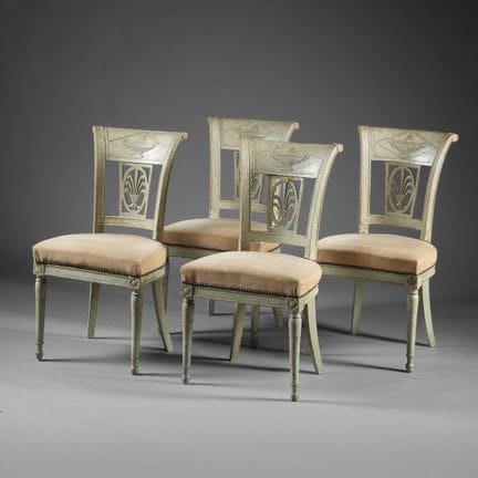 Set of four chairs with curved backs, made of gree