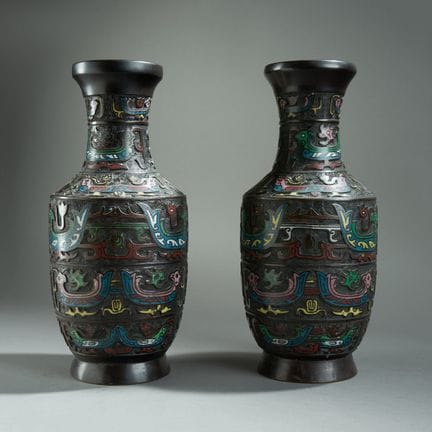JAPAN.
Pair of bronze baluster vases with a brown 