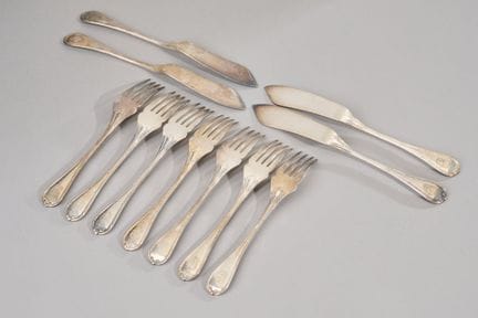 CHRISTOFLE.
Seven forks and four fish knives in si