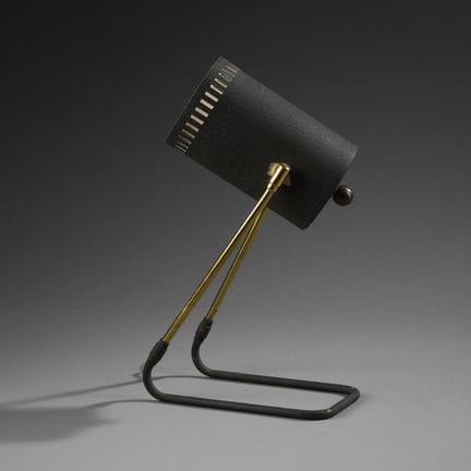 Table lamp made of gold-colored and black-lacquere