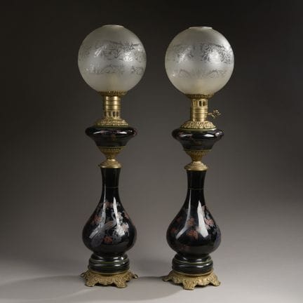 Pair of black-glazed ceramic kerosene lamps with p