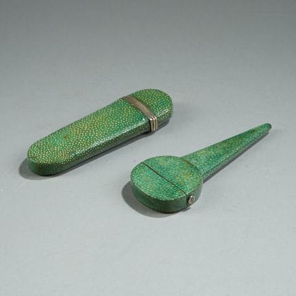 Two green-stained stingray leather cases, one for 