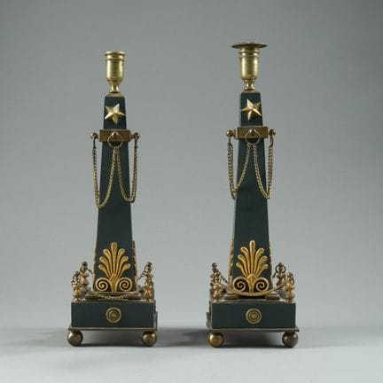Pair of obelisk-shaped candlesticks made of green-