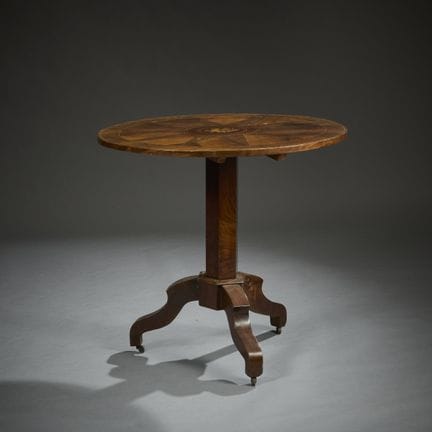 Three-legged side table made of mahogany and mahog