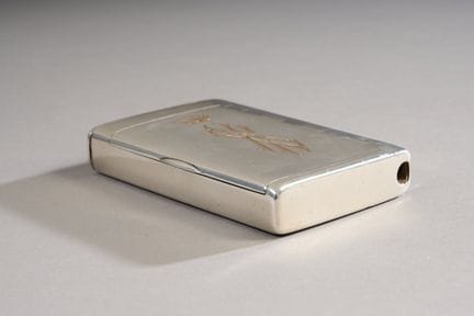 Plain 800-thousandths silver cigarette case.
The t