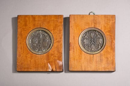 Two medallions made of hammered and repoussé iron 