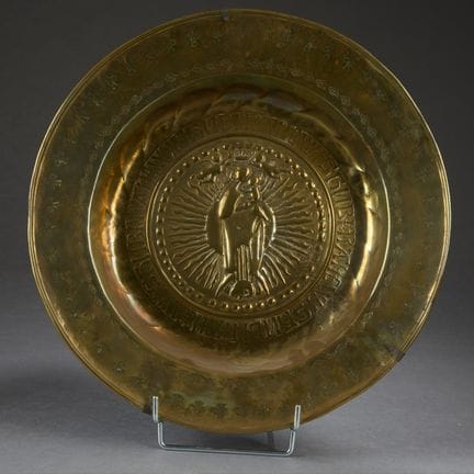 Stamped, repoussé, and engraved brass offering dis