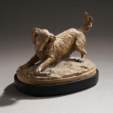 J. COTTE (19th century).
A spaniel playing with a 