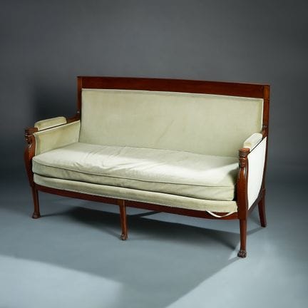 Mahogany sofa with a panel back; the armrests are 
