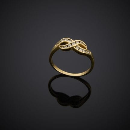Bague en or jaune 585 millièmes, au motif du signe