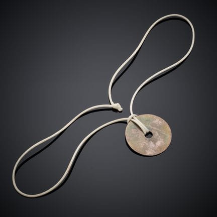 DINH VAN "PI". 
Collier sur cordon, retenant un pe