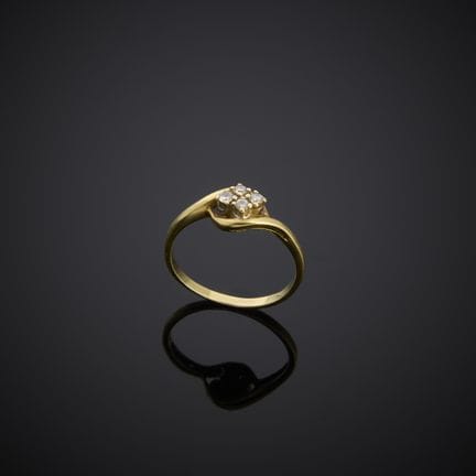 Bague en or jaune 585 millièmes, sertie de quatre 