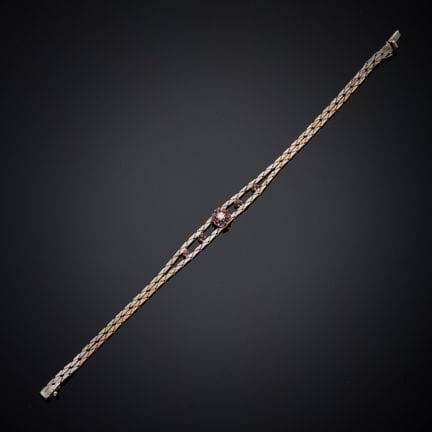 Bracelet en métal argenté, centré de dix petits gr