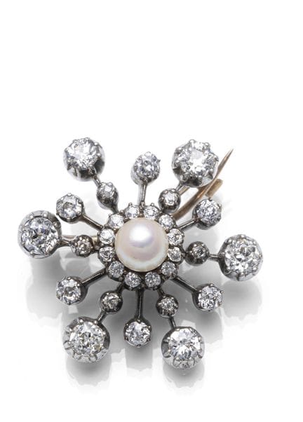 Diamant Brosche
2,6 x 2,8 cm

333/000 Rotgold (get
