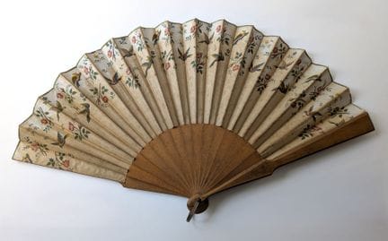 Folded fan, with wooden ribs and a fabric panel de