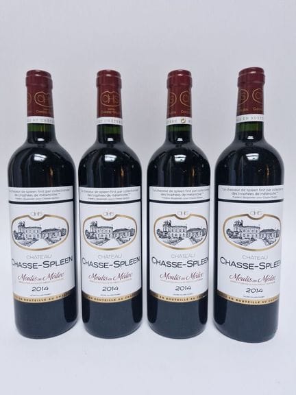 Cuatro botellas de Château CHASSE-SPLEEN de 2014. 