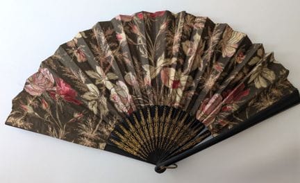 Folded fan; the ebony ribs are partially decorated