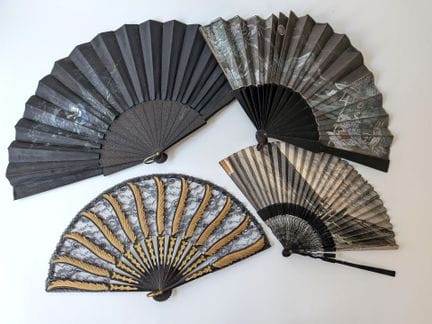 A set of four fans consisting of: 
- A folding fan