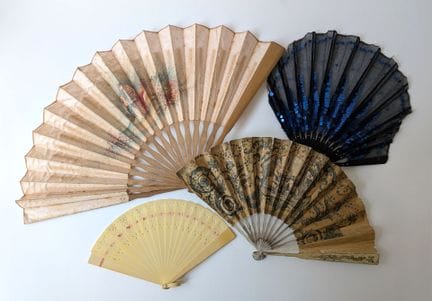 A set of four fans consisting of: 
- A folded fan 