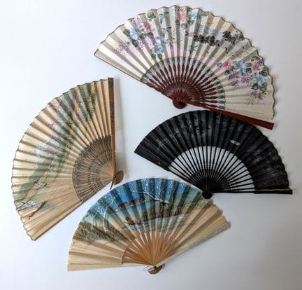 A set of four fans consisting of: 
- A folding fan
