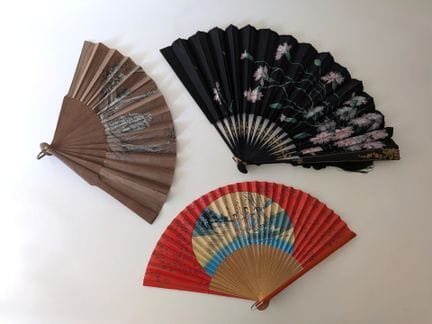 A set of three fans consisting of: 
- A folding fa