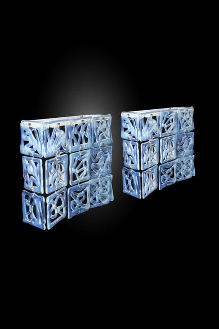 MAZZEGA
Paire d'appliques
Structure en métal peint