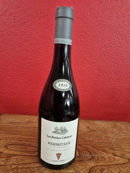 Una botella de HERMITAGE «Les Petites Cabanes» 201