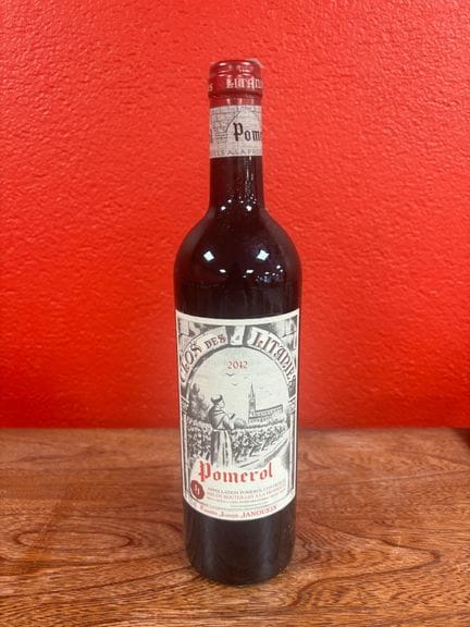 Una botella de CLOS DES LITANIES Pomerol (entre Pé