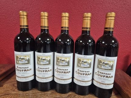 Cinq bouteilles de Chateau Coufran 2003