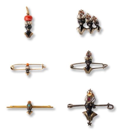 Five Moretti head brooches and a pendant
early 20t