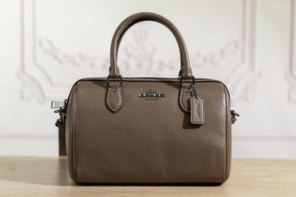 COACH - Sac polochon en cuir grainé taupe, double 