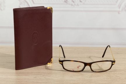 CARTIER - Lot comprenant un porte bloc note en cui