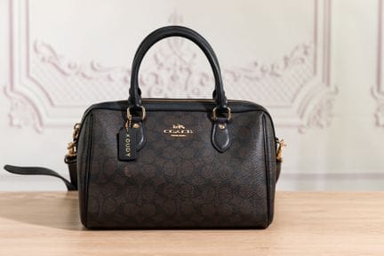 COACH - Sac polochon en toile enduite marron et cu